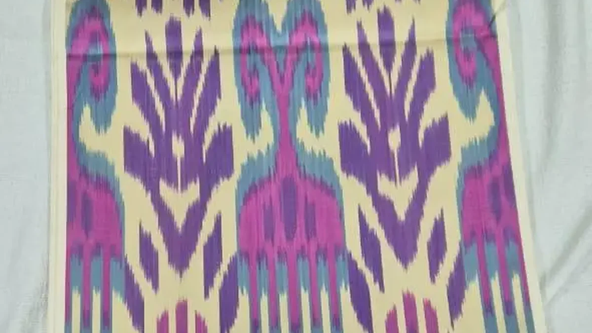 Purple and turquoise ikat panel with symmetrical woven motifs