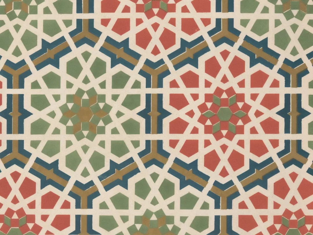 Geometric Islamic pattern with interlocking red, green, and blue shapes forming star motifs on a white background, adding a touch of luxury to any space.