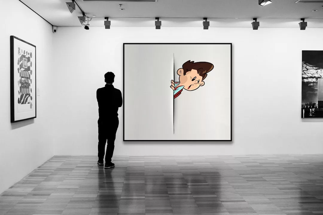 A person stands in a luxury art gallery, looking at a large artwork depicting a cartoon character peeking through a slit in the canvas.