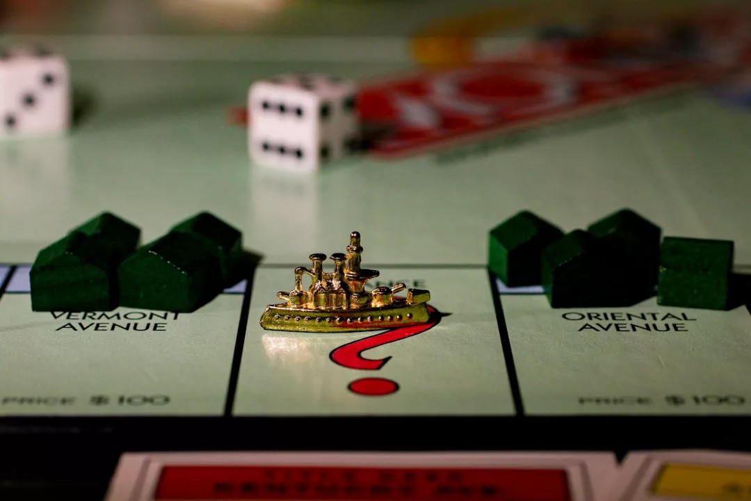 A Monopoly game board showing the battleship token on the Chance space, with houses on Vermont Avenue and Oriental Avenue, dice in the background, and a touch of luxury on every corner.