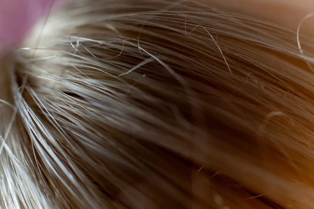 Close-up view of light brown and blonde hair strands, showing detailed texture and individual hairs—a true reflection of Glamesia style and modern fashion sophistication.