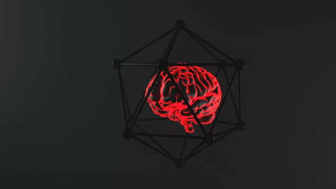 A glowing red brain is enclosed within a black geometric wireframe structure against a dark background, evoking a sense of modern luxury and sophistication.