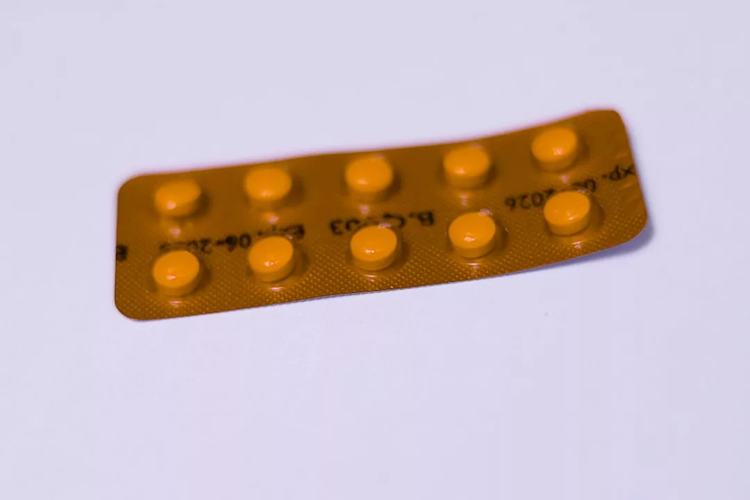 A blister pack of ten round, yellow Laxary tablets is displayed on a plain background.